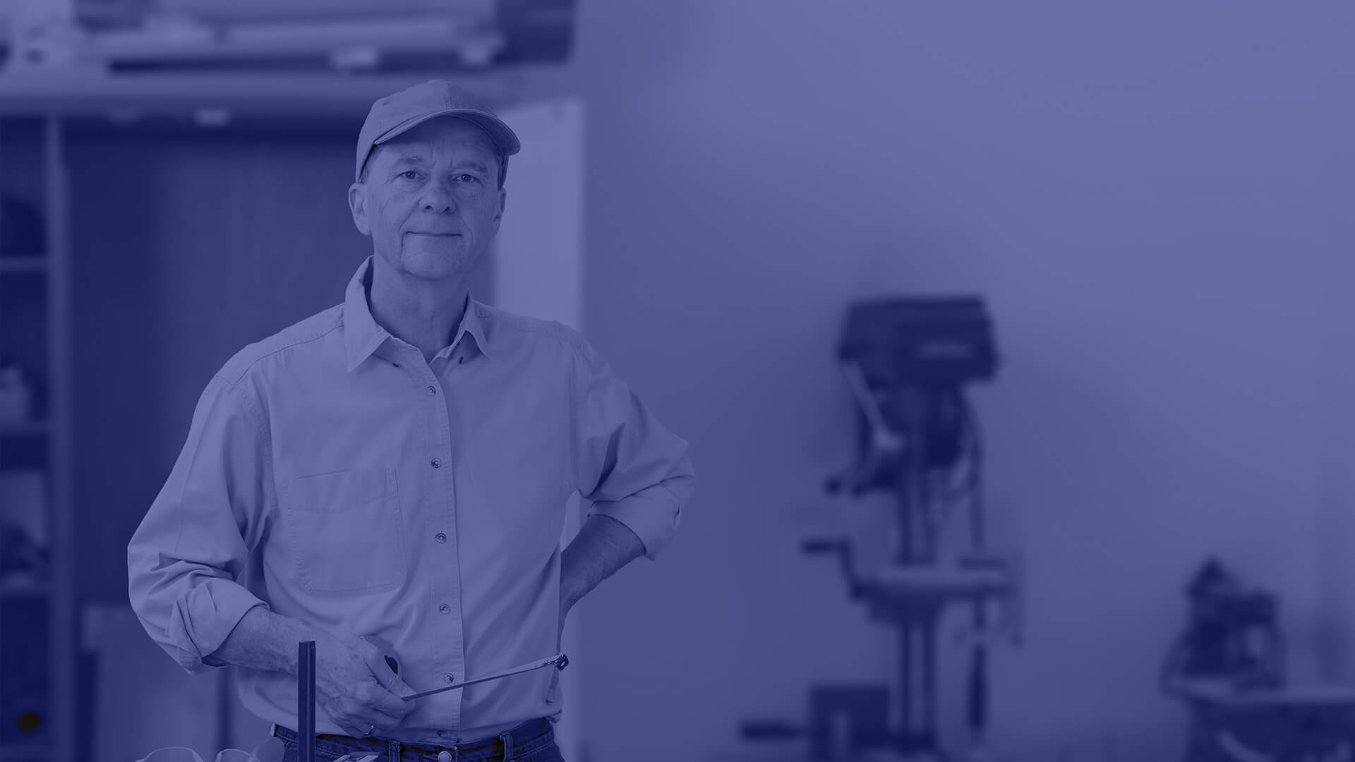 A male energy worker standing with a tape measurer in his hand